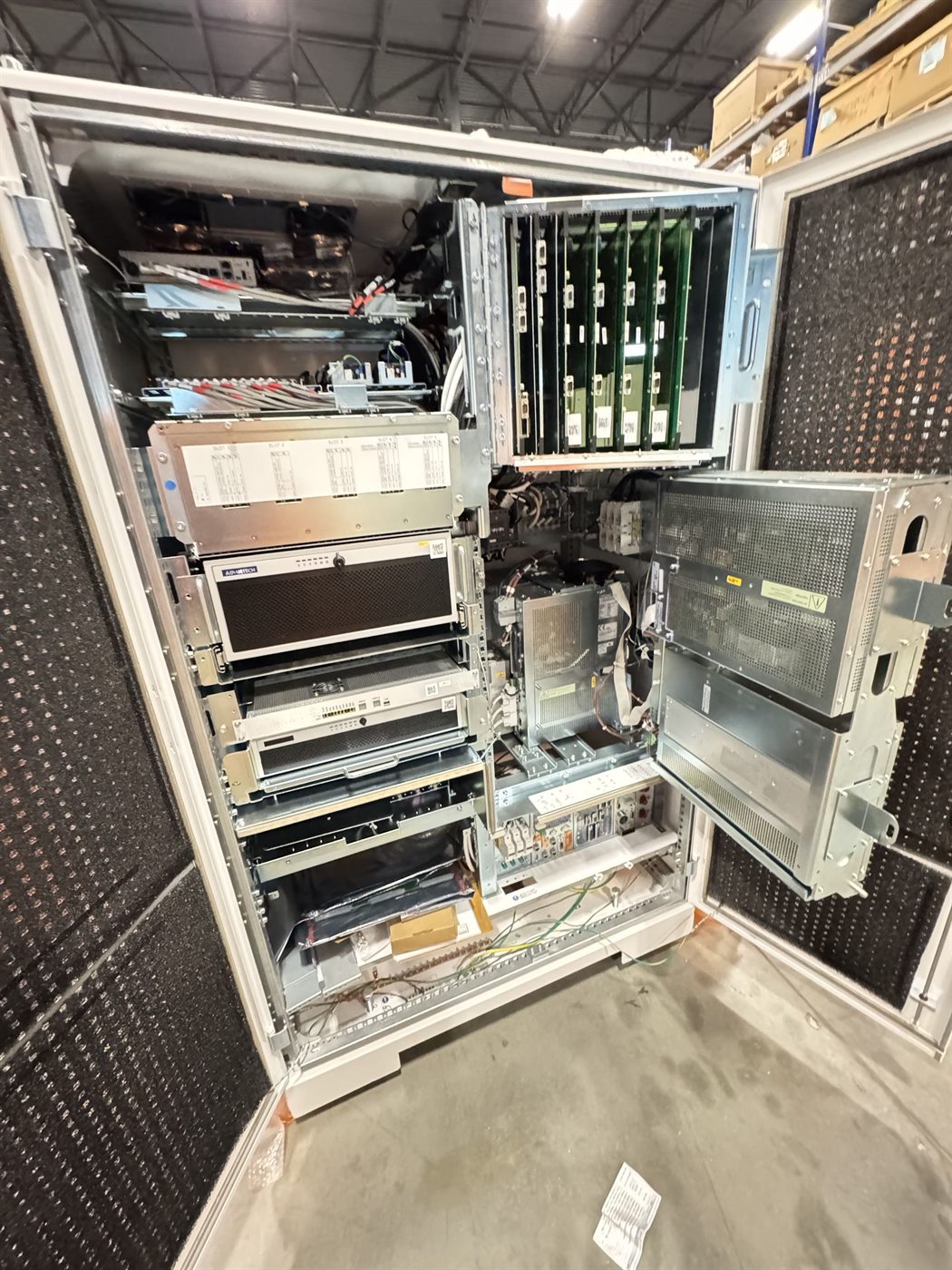 Technician point of view inside an open equipment cabinet